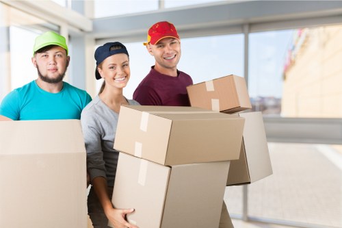 Removal team preparing a flat move in Wandsworth with boxes and furniture