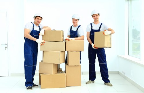 Commercial moving team handling office furniture in South West London